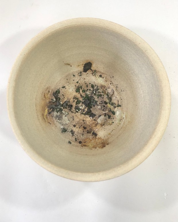 Empty stoneware pot with firing residue